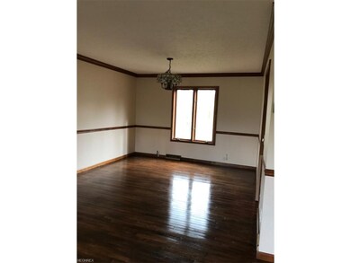 Dining room with chair rail and crown molding.
