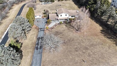 expansive front yard separates house from road
