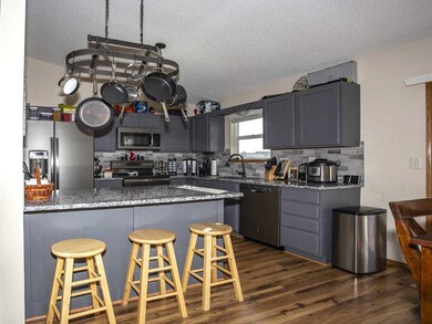 Breakfast Bar w/ Granite Counter-Tops