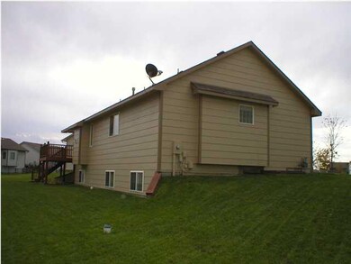 Side view of yard. Well is visible.