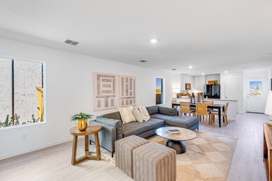 Living room featuring light wood-style floors and recessed lighting