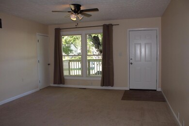 Living room w/ hall closet