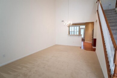 New neutral carpeting in the combined living and d