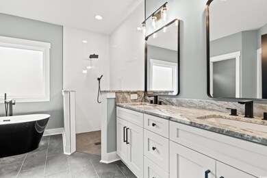 Bathroom featuring tile patterned flooring, vanity