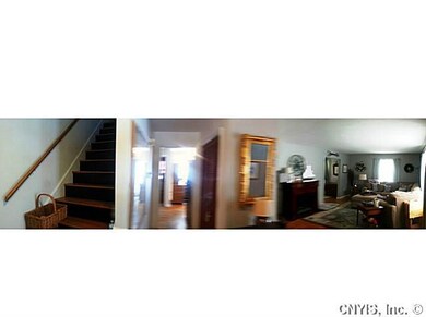 Foyer. Hardwood flooring and updated lighting are 