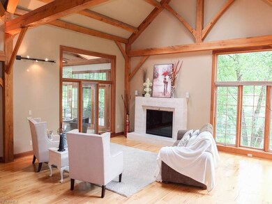 2-story great room with wood flooring and a firepl