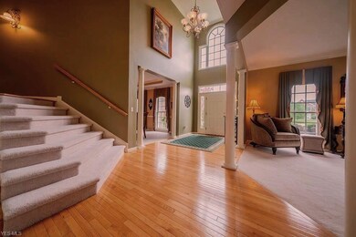 The Grand Foyer is accented with a two story ceili