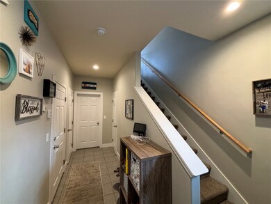 Hall featuring tile flooring