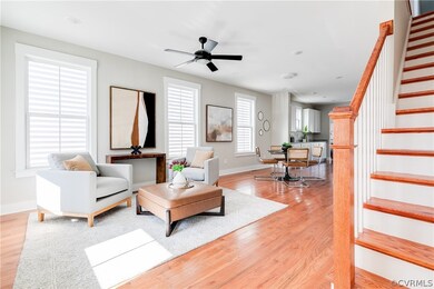 Living room with light hardwood / wood-style floor