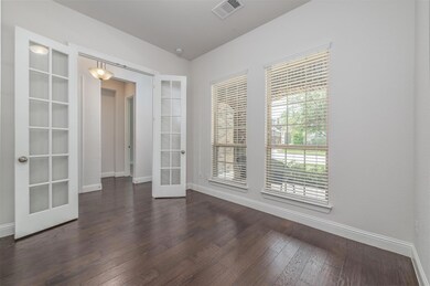 Office featuring french doors and wood flooring