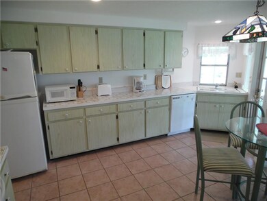 kitchen with corner sink and French door to the sc