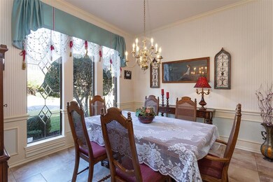 Nice sized formal dining with wonderful natural light.