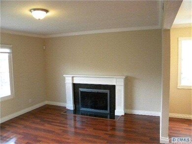Living room. Dining area and kitchen to the right.