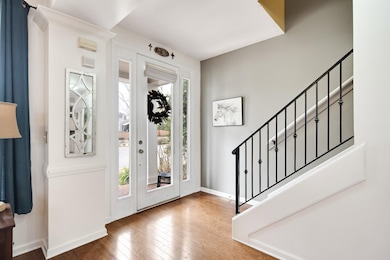Entryway with baseboards, stairs, and hardwood / w
