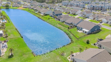 Bird's eye view with a water view and a residentia