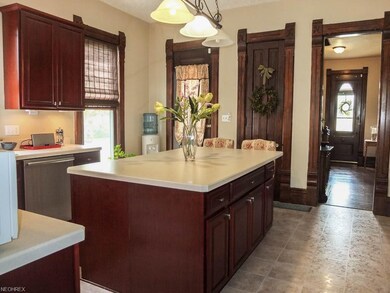 Kitchen has beautiful woodwork.