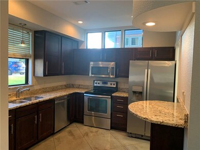 Beautiful kitchen with plenty of cabinet space, granite countertops, and stainless steel appliances.