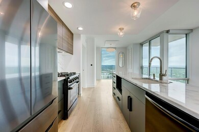 Kitchen with stainless steel fridge, gas stove, a