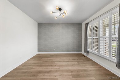 Unfurnished dining area featuring a chandelier, an