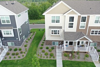 Highly sought-after end unit over looking park pre