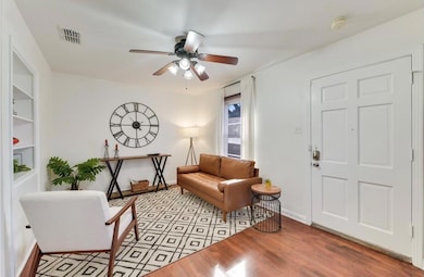 Living area with light wood finished floors and a