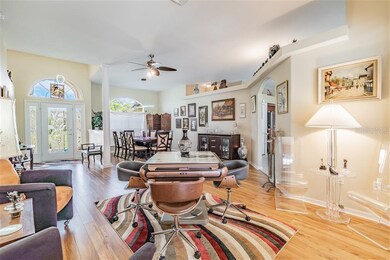 Open concept floorplan with arched doorways and wi