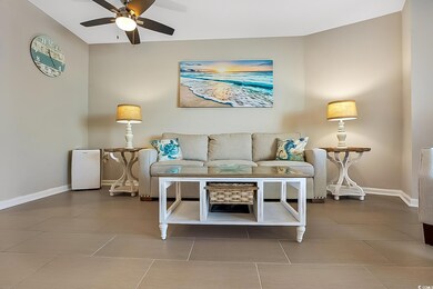 Living room featuring ceiling fan