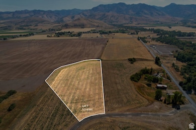 Aerial overview of property's location with property parcel outlined and rural landscape