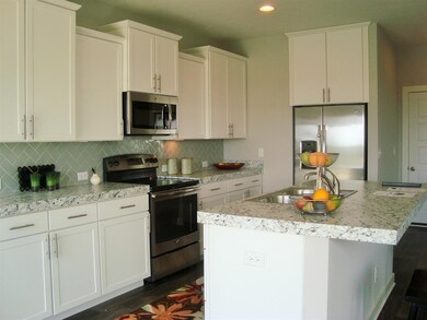 Easy to love kitchen with stainless appliances, an