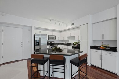 Kitchen featuring a breakfast bar area, stainless