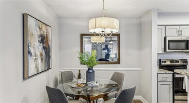 Dining area featuring a textured ceiling and an in