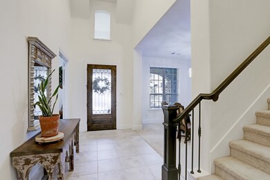 There is a 2 story tiled entrance as you enter the home with great architectural detail and extra window  over the door to let in lots of natural light into the the foyer.