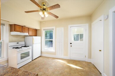 Built in spice rack in kitchen wall.