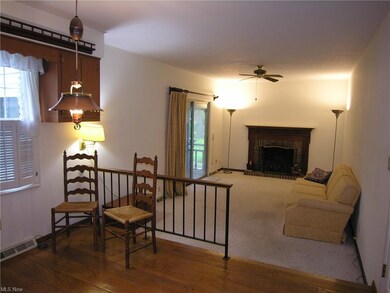 Family Room off Kitchen with entry to large enclos