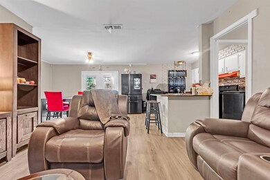 Living area with light wood-type flooring