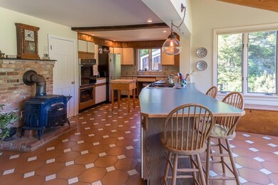 Kitchen with dining counter and wood...
