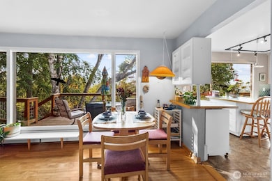Dining space filled with light, offering direct access to the kitchen and living room for effortless entertaining.