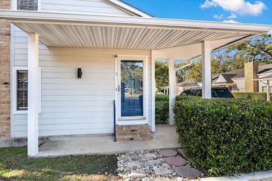Property entrance with covered porch