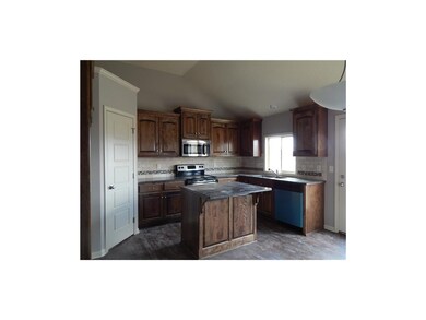 Kitchen with nice pantry and island.  Walks out to