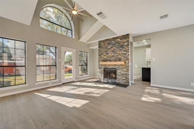Soaring cathedral ceiling in living room with indu