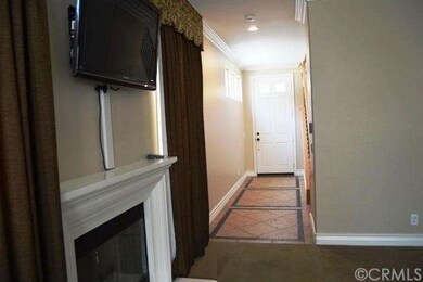 Elegant tiled entry leading to large open living r