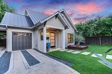 View of front facade featuring a standing seam ro