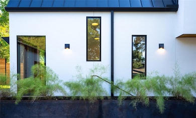 View of side of property with a standing seam roo