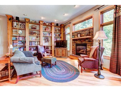 Custom built-in library, newer gas fireplace, & hi