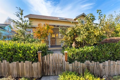 Fenced yard area with established gardens.