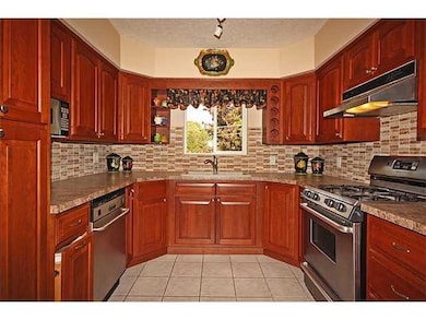 Kitchen. Cherry kitchen with stainless appliances 