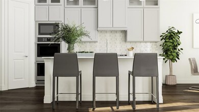 Kitchen featuring stainless steel oven, decorative