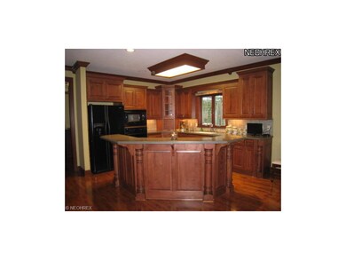 Beautiful, open kitchen with cherry cabinets and s
