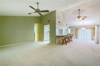 View from entryway. Living room to the left with K