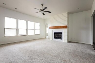 Unfurnished living room with visible vents, a ceil